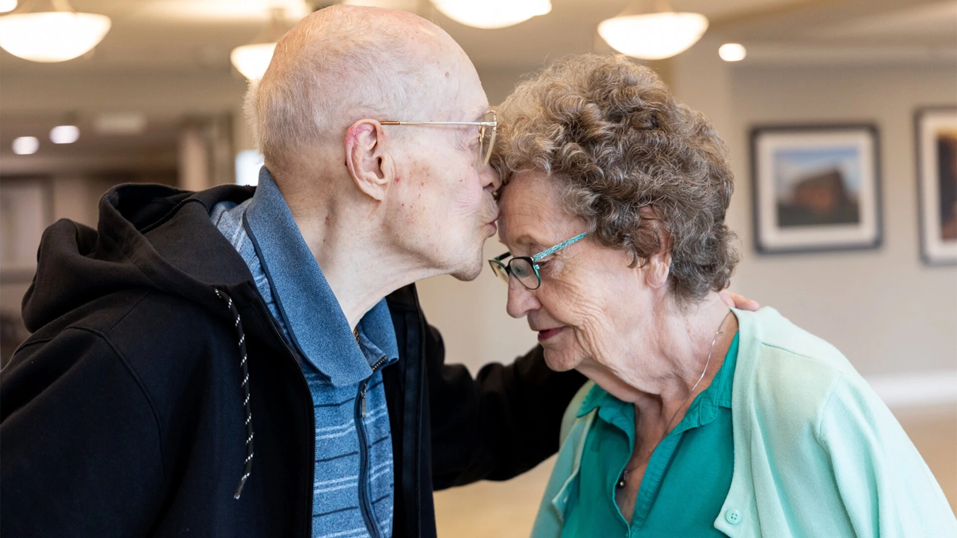 At the Hamlets, an elderly guy kisses his wife on the forehead (red deer)